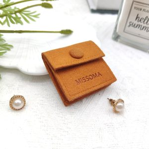 Microfiber embossed jewelry pouch with divider insider